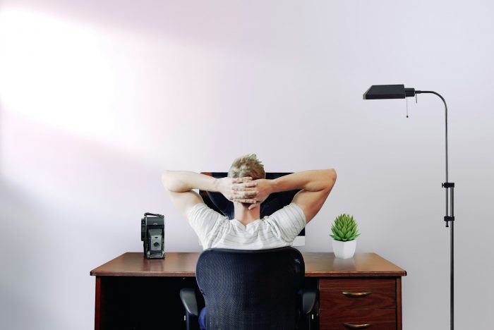 Man sat at a desk working from home