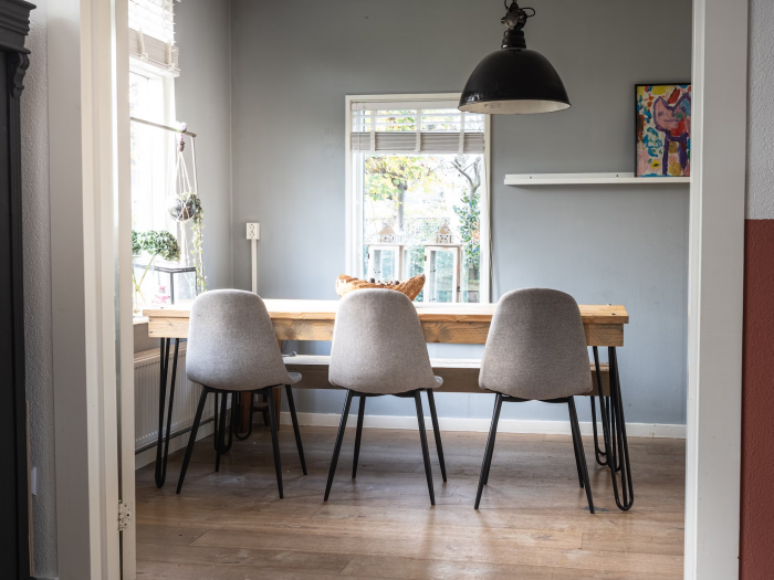 Dining room with a contemporary design with dining chairs and table 