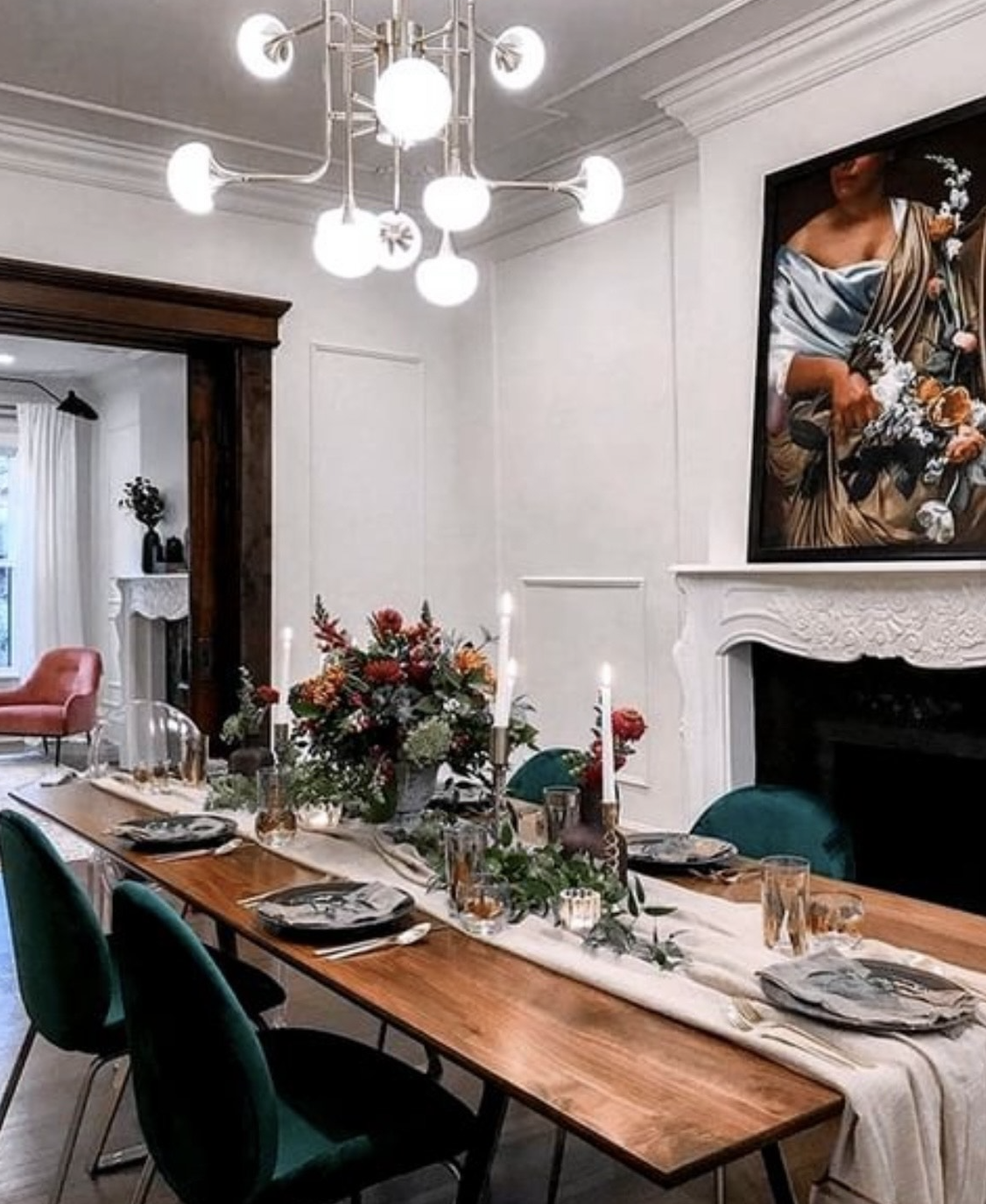 Dining room table set up with green velvet chairs