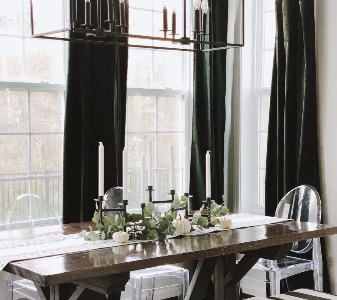 Dining room table set up with flowers and candles
