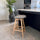 Soho Clear and Light Grey Plastic Bar Stool with Light Wood Legs