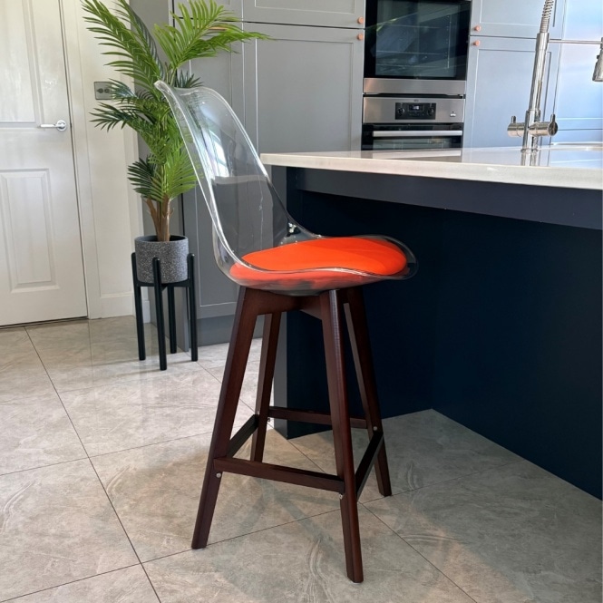 Fusion Living Soho Clear and Orange Plastic Bar Stool with Dark Wood Legs