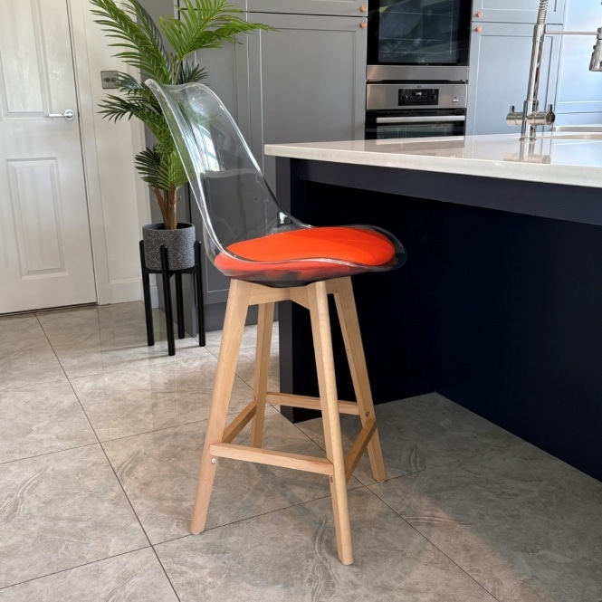 Fusion Living Soho Clear and Orange Plastic Bar Stool with Light Wood Legs